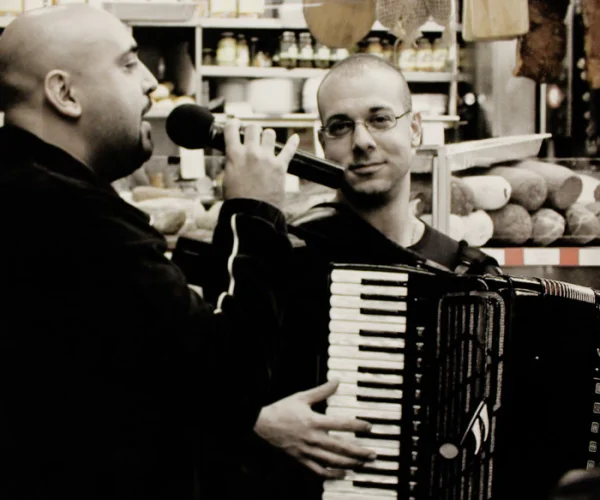 Emilio Magnotta playing accordion alongside a singer