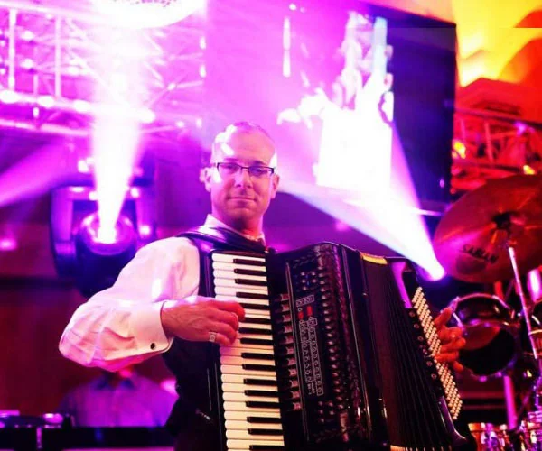 Emilio Magnotta playing accordion on stage